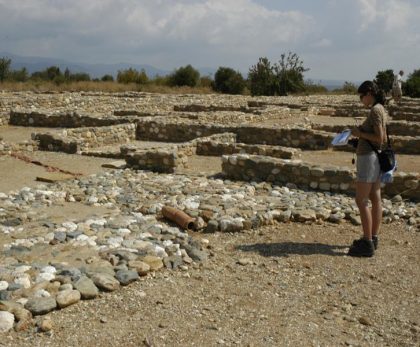 Visitor exploring ruins of Ancient Olynthos