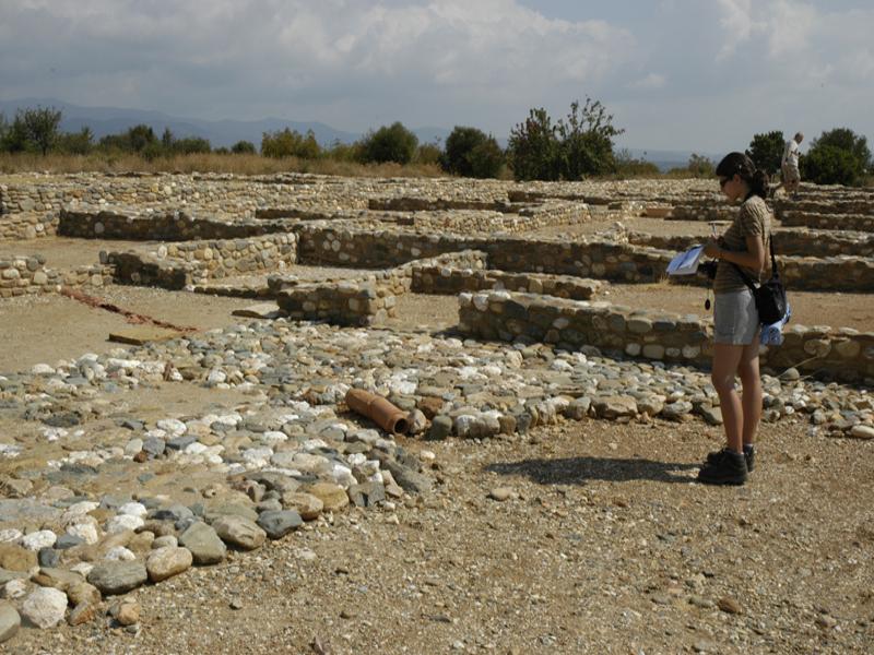 Visitor exploring ruins of Ancient Olynthos